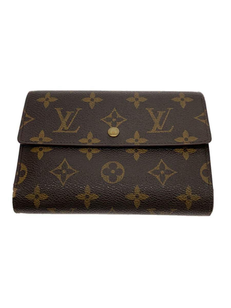 Front view of a brown Louis Vuitton monogram canvas wallet with a snap-button flap.
