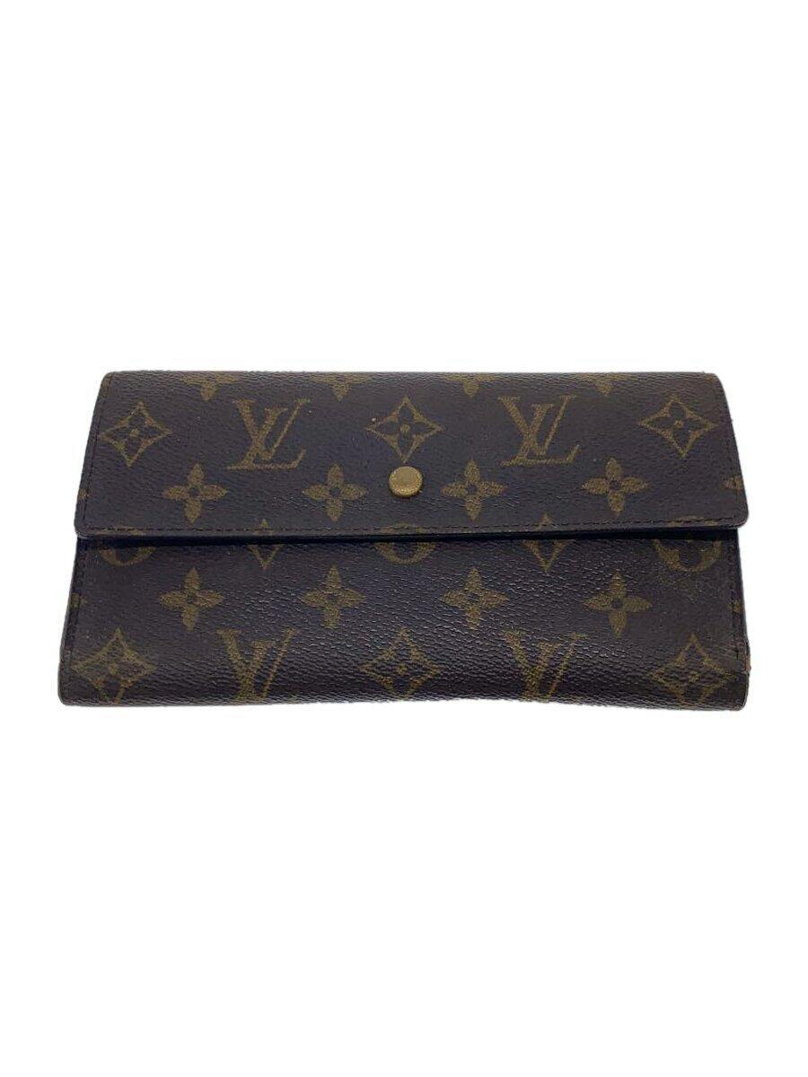 Front view of a brown Louis Vuitton monogram canvas women's wallet with a flap and snap closure.