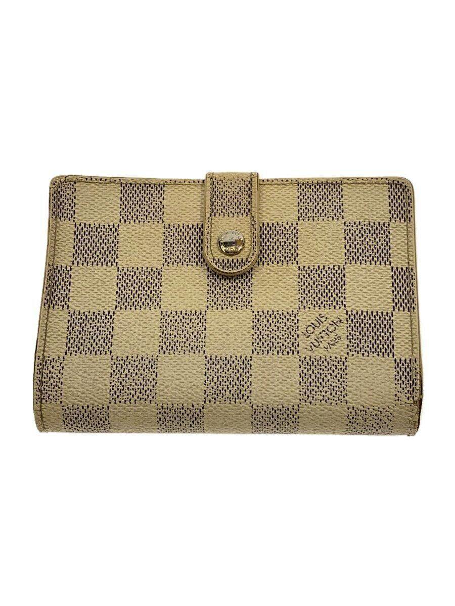 Front view of a Louis Vuitton Damier Azur checkered wallet with a snap closure.