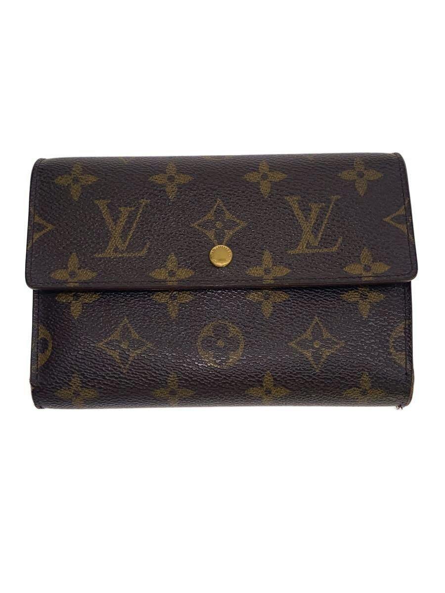 Closed Louis Vuitton monogram canvas wallet with a central gold snap button on a white background.