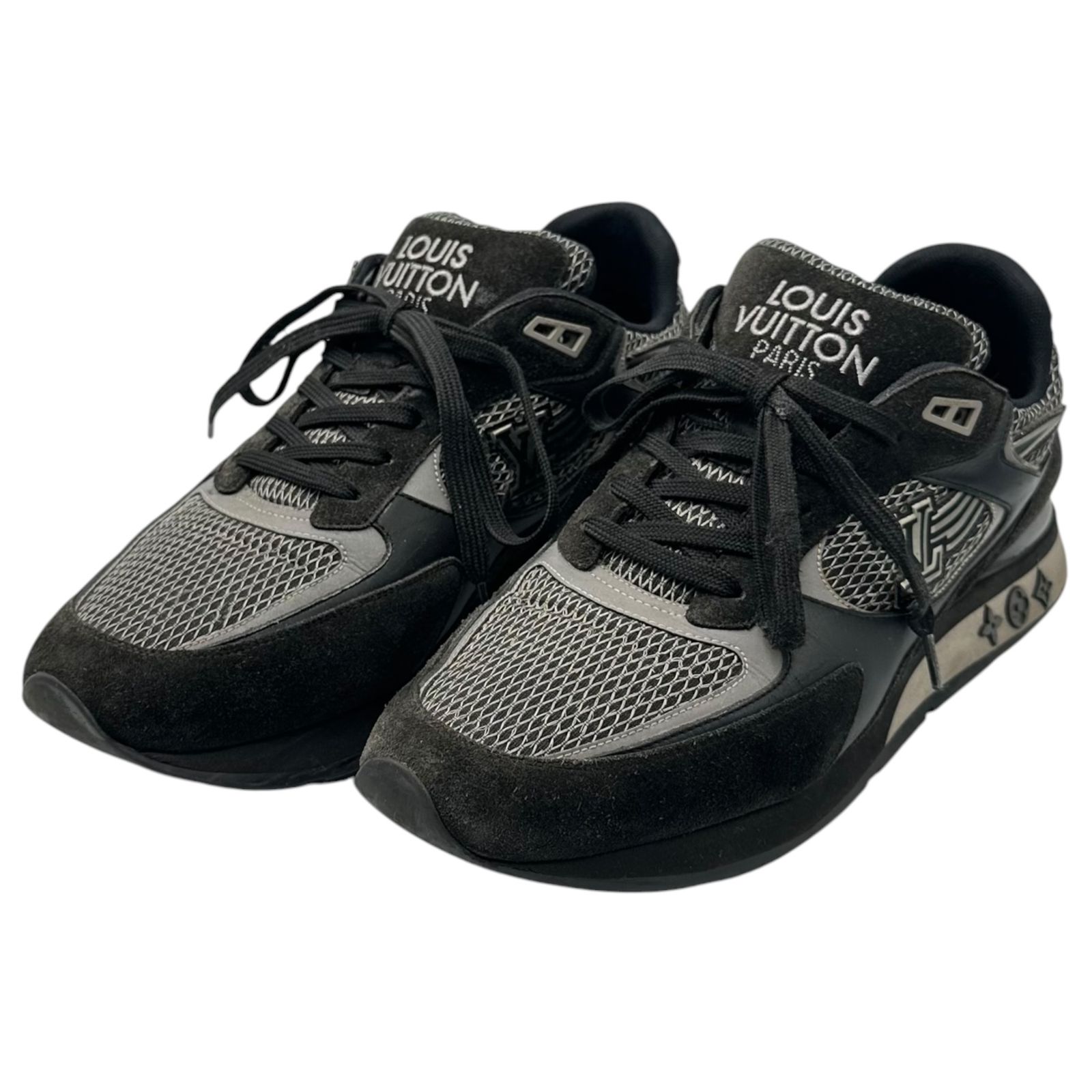 Pair of black and gray Louis Vuitton Run Away Line sneakers photographed from a front three-quarter view.