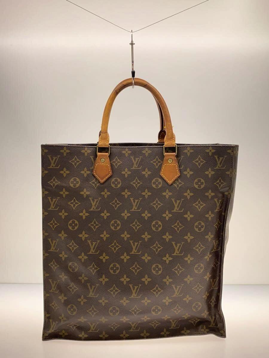 Front view of the Louis Vuitton monogram canvas brown tote bag with rounded leather handles.