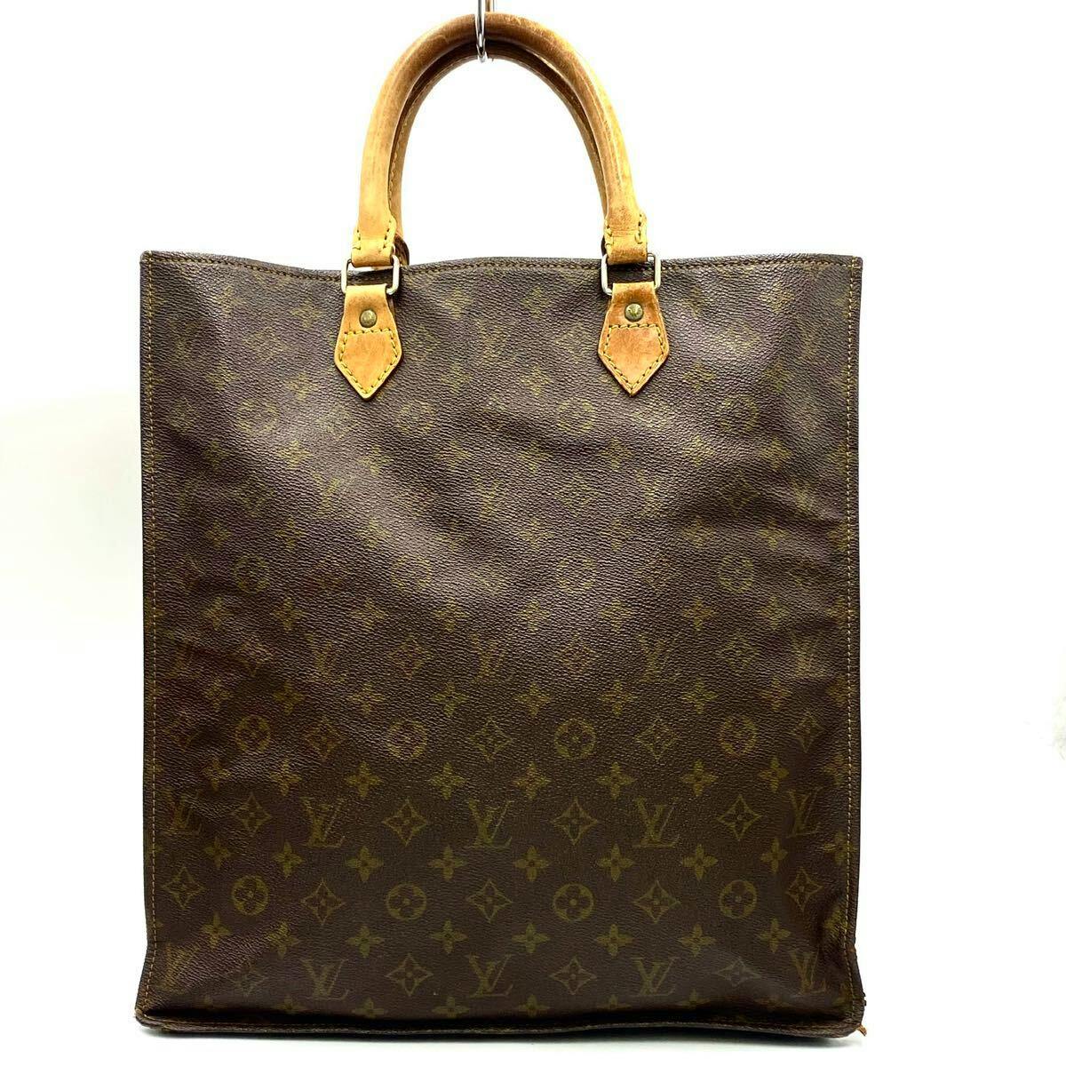 Front view of a LOUIS VUITTON monogram canvas Sac Plat tote bag with leather top handles.