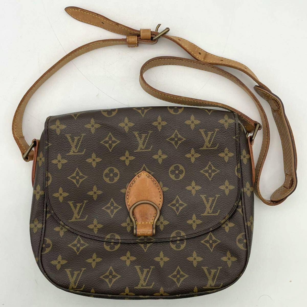 Front view of a Louis Vuitton monogram canvas shoulder bag with adjustable leather strap and front flap closure.