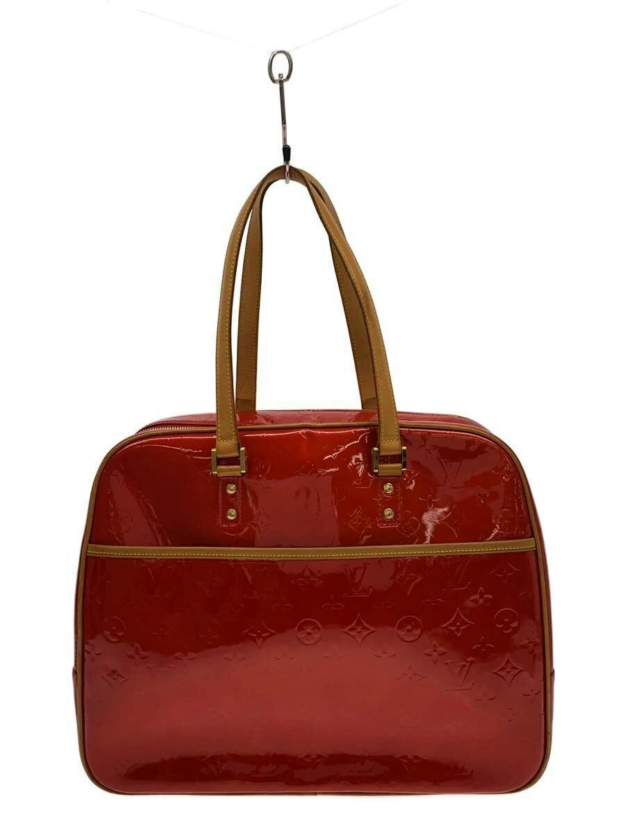 Front view of a red Louis Vuitton Monogram Vernis leather bag with tan handles and gold hardware on a white background.