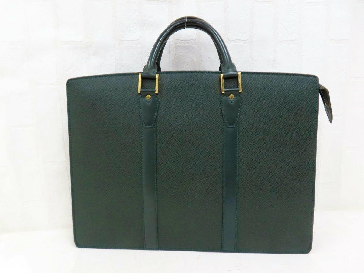 Green Louis Vuitton leather business bag shown from the front with double top handles and gold-tone hardware.
