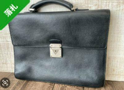 Front view of the black cow leather Louis Vuitton business briefcase with top handle.