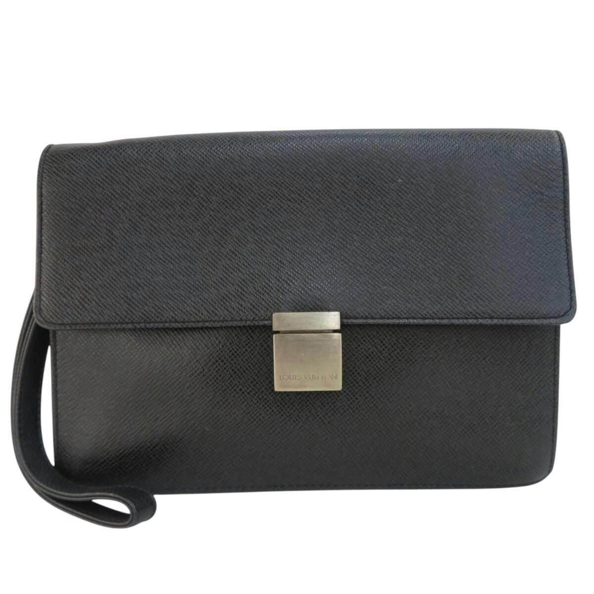 Front view of a black Louis Vuitton cow leather bag with a flap, wrist strap, and a metal Louis Vuitton clasp.
