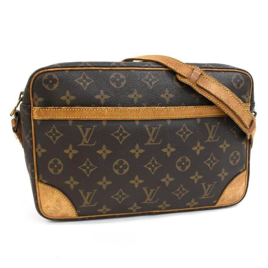 Front view of a brown Louis Vuitton monogram canvas shoulder bag (Trocadero 30) with leather trim and adjustable strap.