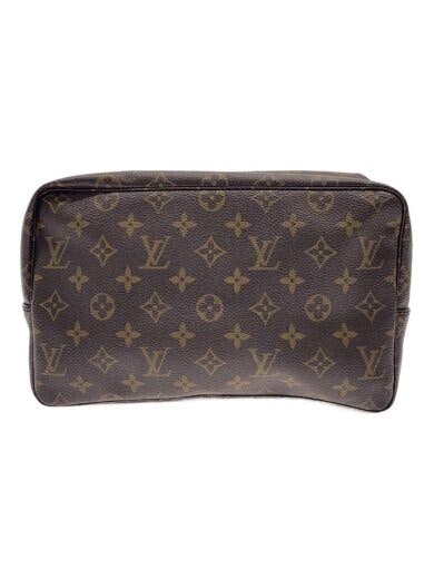 Front view of the トゥルース・トワレット28 monogram canvas/PVC toiletry pouch in brown showing the repeating monogram pattern.