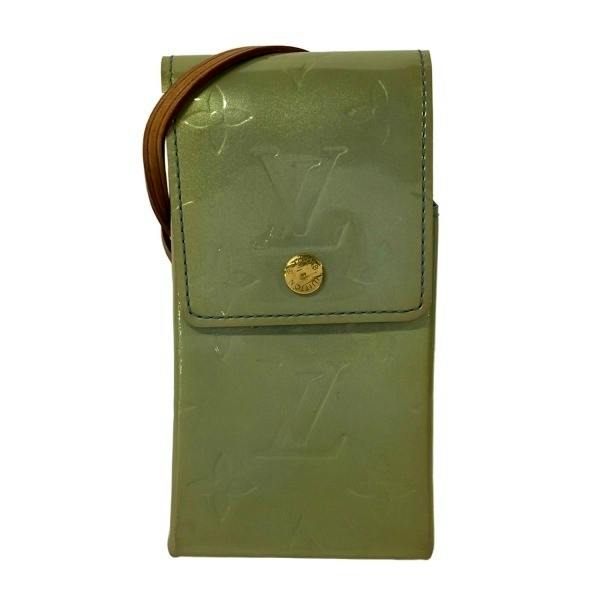 Green Louis Vuitton Vernis leather cigarette case/wallet with embossed LV monogram and a flap with a gold snap.