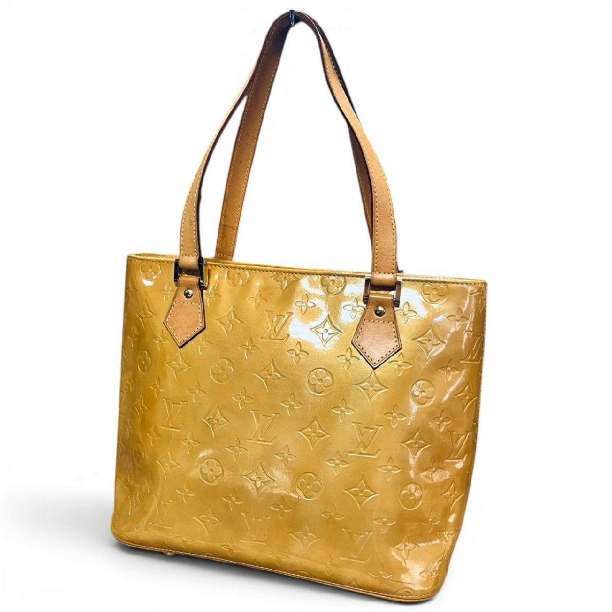 Yellow Louis Vuitton Vernis Houston tote bag showing embossed monogram pattern and tan leather shoulder straps.