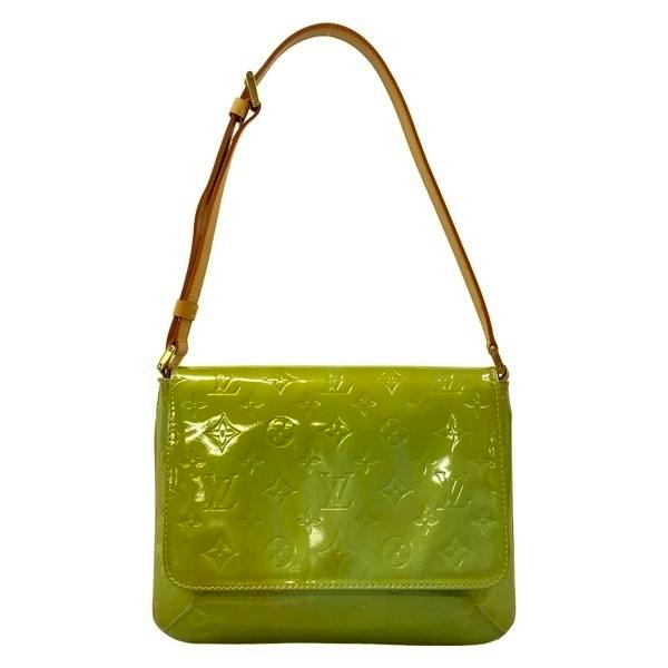 Front view of the Louis Vuitton Thompson Street Vernis leather shoulder bag with monogram embossing and a single leather strap.