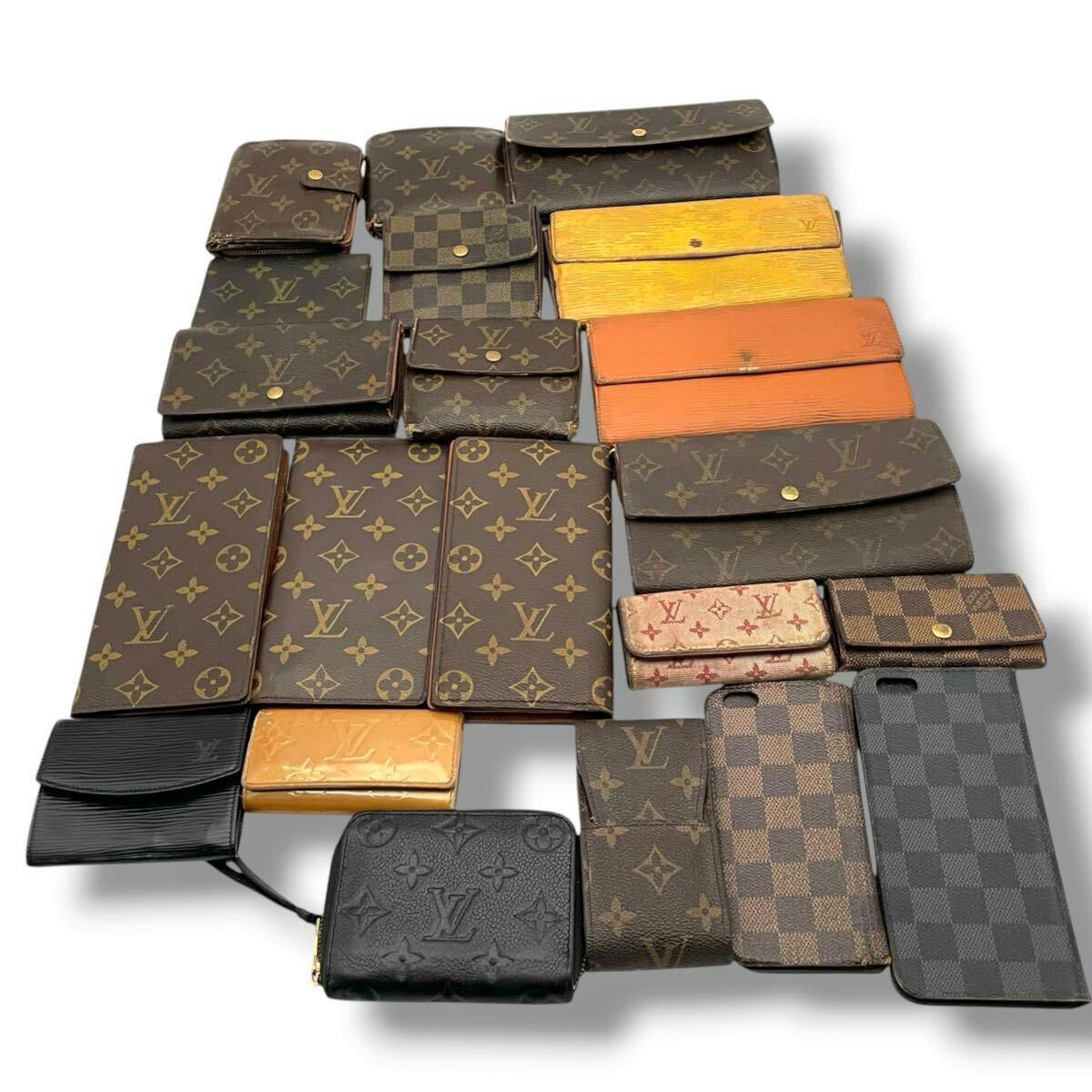 Multiple Louis Vuitton wallets and small leather goods in monogram and checkered (Damier) patterns arranged on a white background.