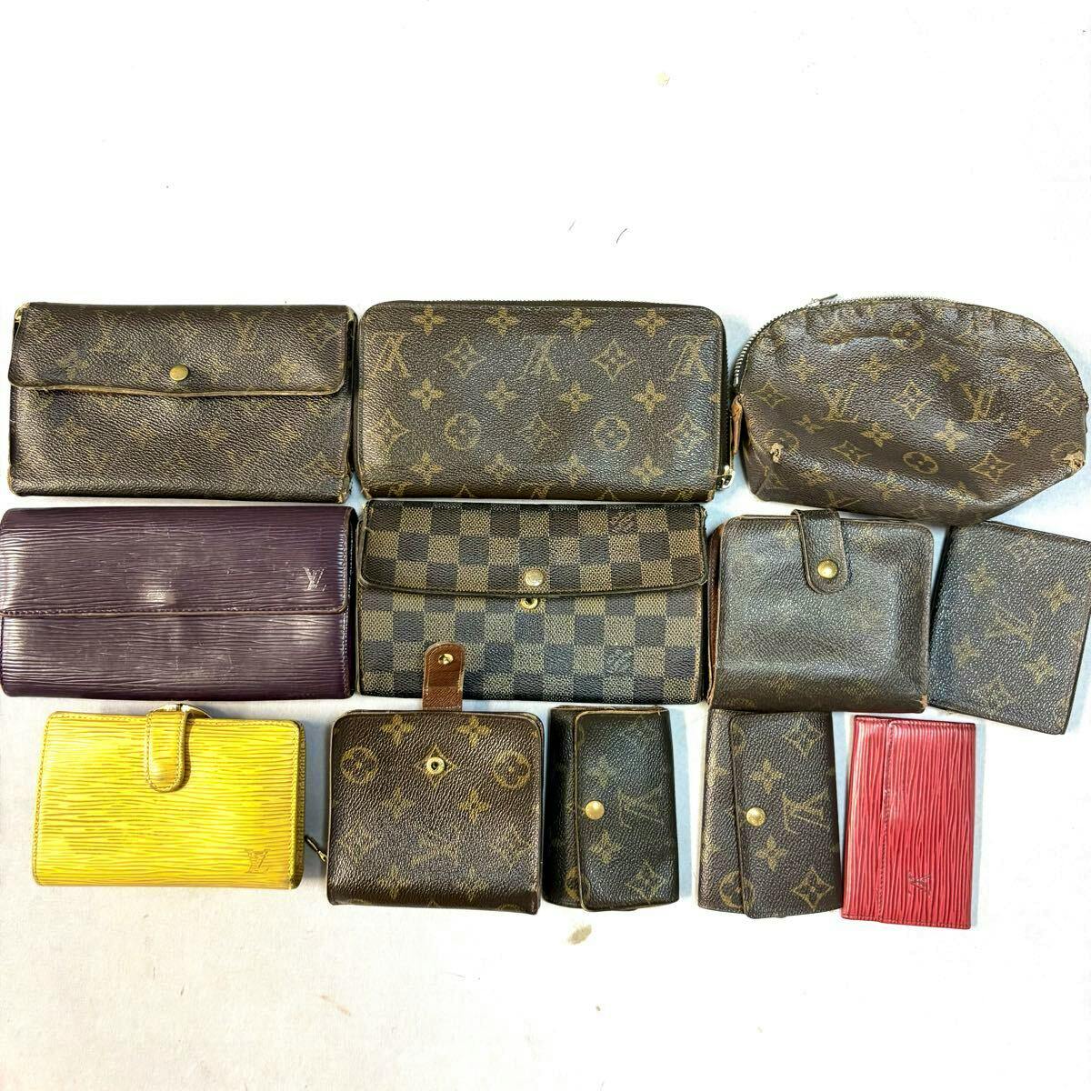 Twelve Louis Vuitton wallets and small leather goods in various monogram, Damier, and Epi patterns arranged on a white background.