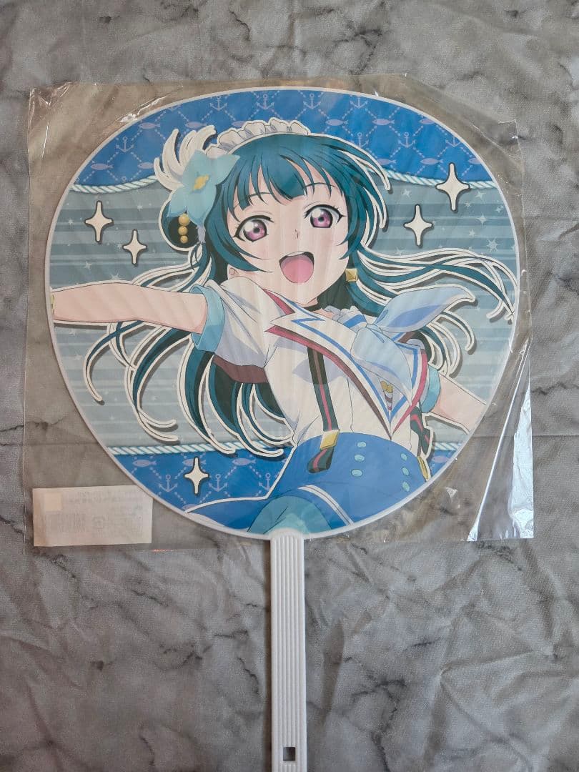 Paper handheld fan (uchiwa) featuring a printed illustration of the Aqours character 津島善子.