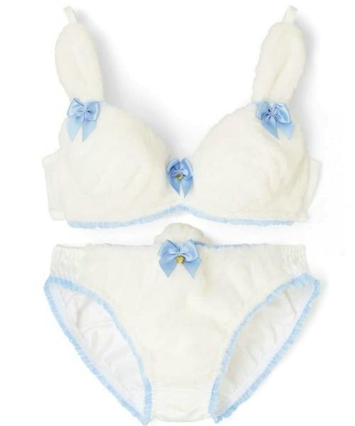 Flat-lay photo of the rabbit-themed white bra and matching panties accented with blue ribbon bows.