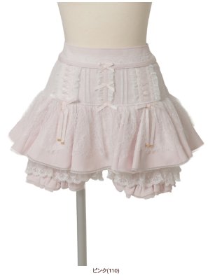 Pink tiered mini skirt with lace and ribbon details displayed on a mannequin.