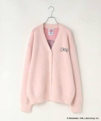 A light pink cardigan hanging on a hanger against a white background with a small Kirby logo on the chest.