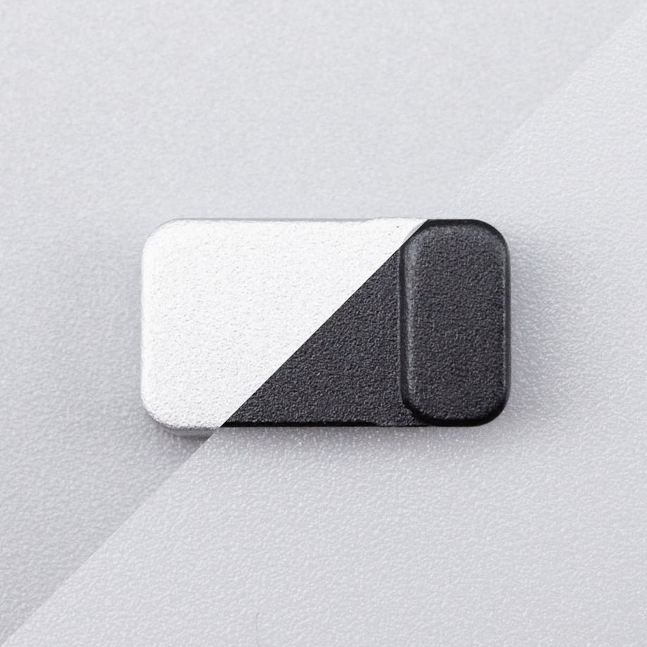 A small rectangular LP lever plate shown isolated on a light textured background.