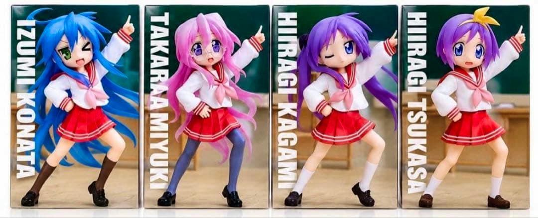 Four boxed らき☆すた Vivit figures wearing school uniforms shown full-body side by side.
