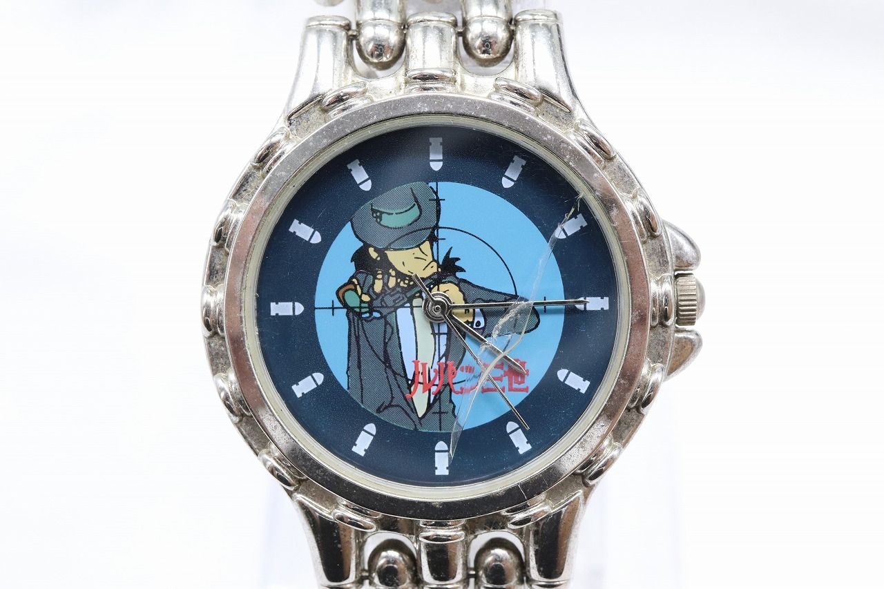 Close-up photo of a men's wristwatch showing Jigen Daisuke (Lupin III) on the dial and a metal bracelet.
