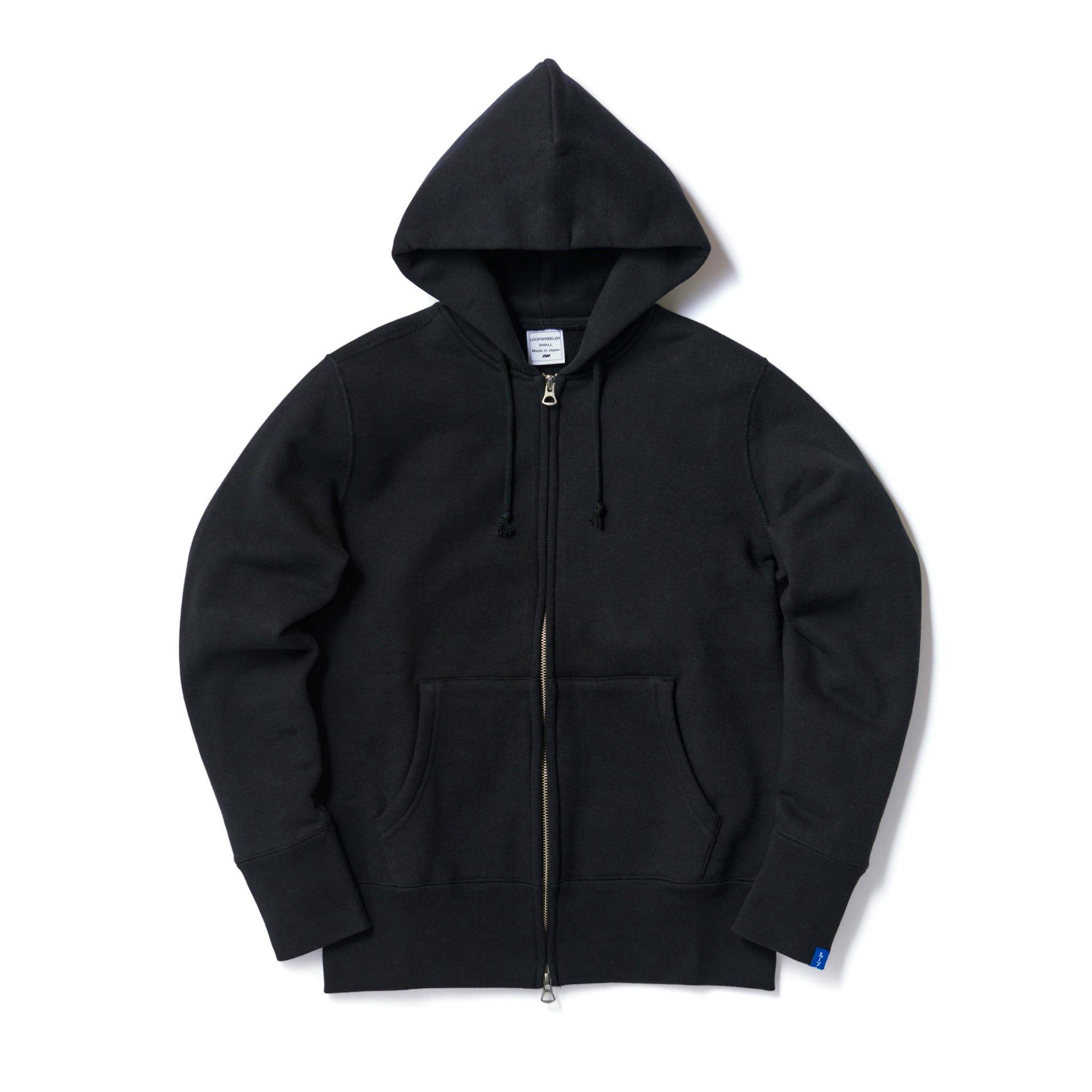 Black LW09 tubular zip-up hoodie laid flat showing the hood, front zipper, kangaroo pockets, and cuffs.