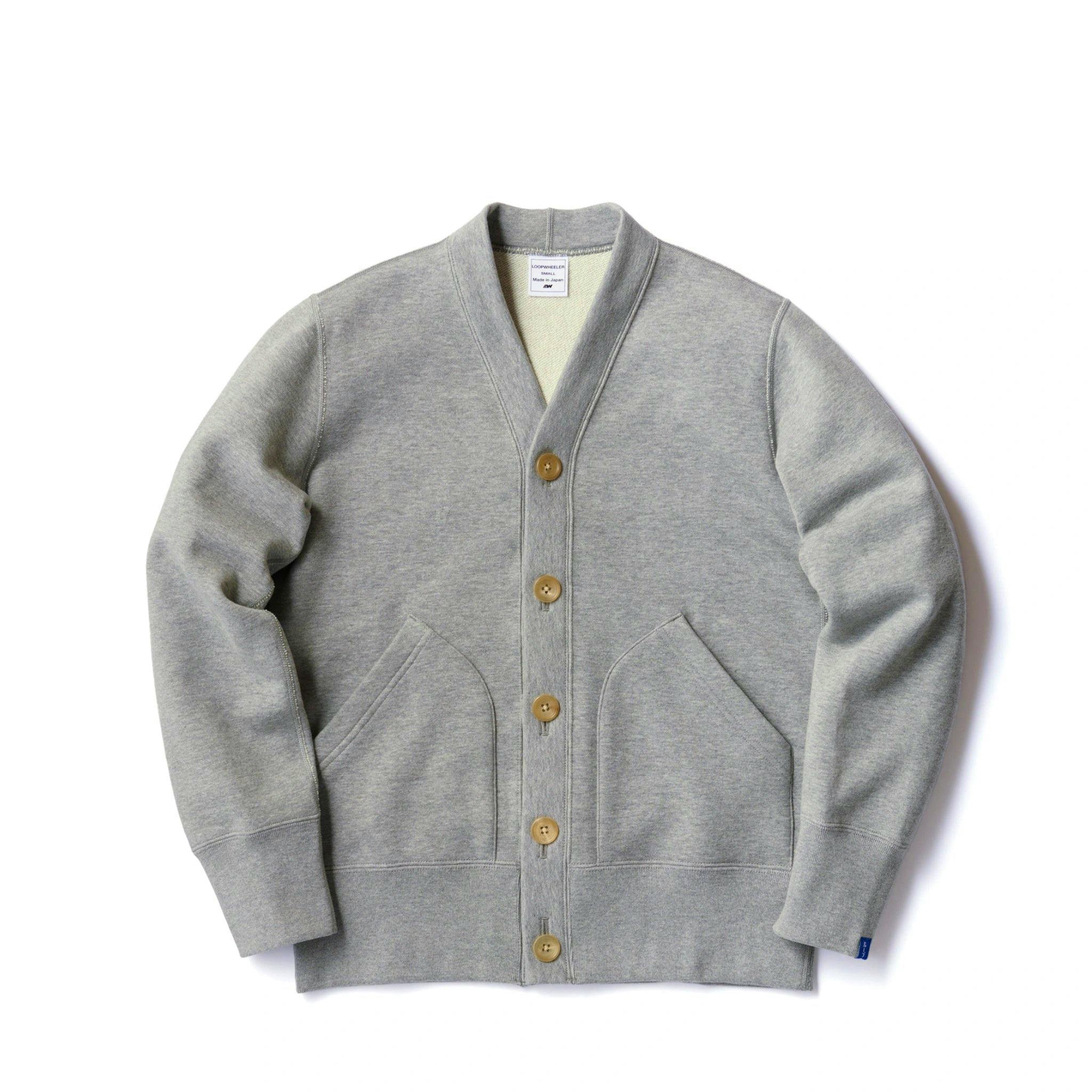 A gray melange cotton cardigan laid flat showing the front buttons, pockets, collar, and sleeves.