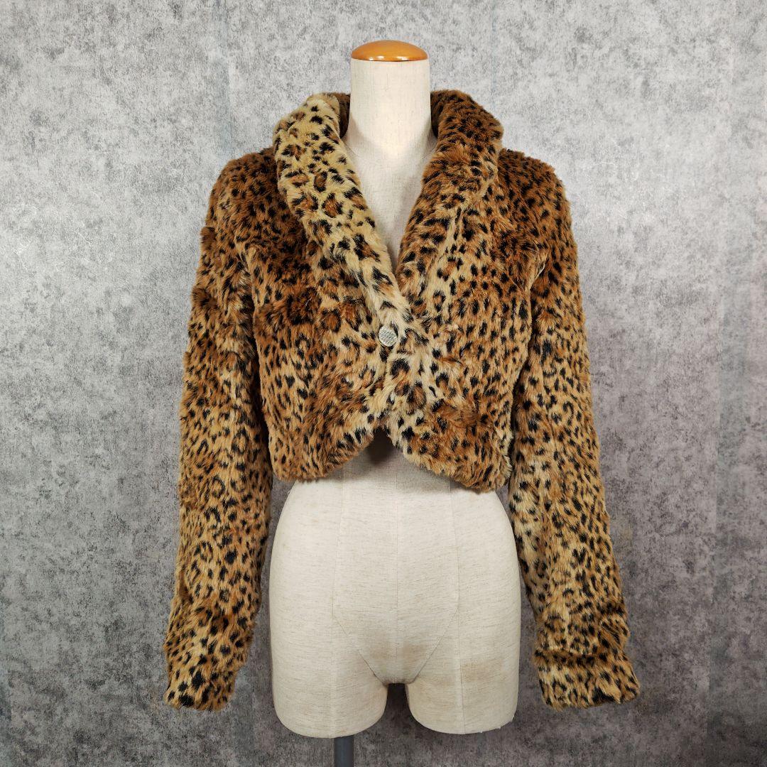 Cropped leopard-pattern faux fur jacket displayed on a dress form.