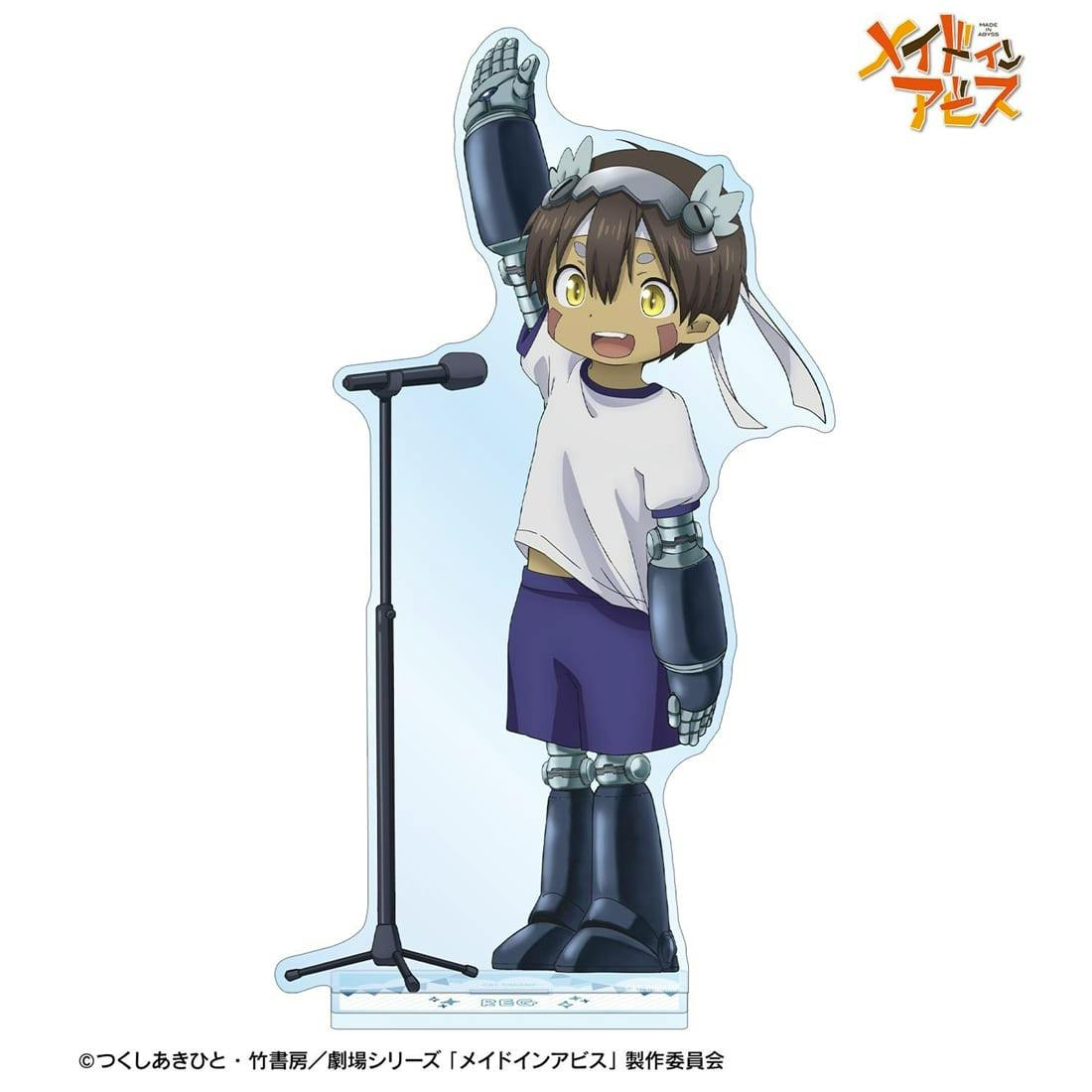 A full-body acrylic stand of Reg from Made in Abyss showing the character with raised arm and mechanical limbs standing next to a microphone on a stand.