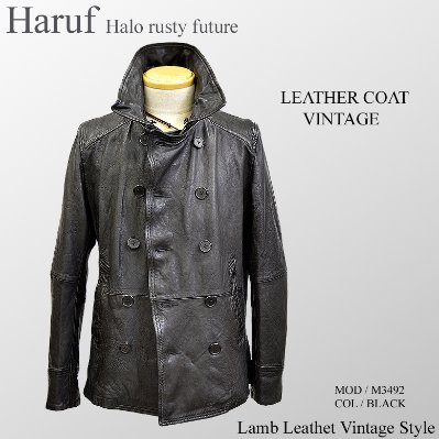 Black vintage-style lamb leather pea coat with double-breasted front and removable collar displayed on a mannequin.