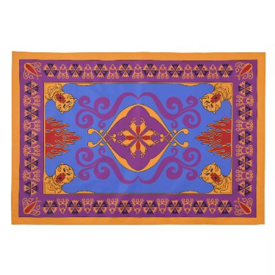 Flat-lay of the compact picnic sheet showing a purple and orange decorative magic-carpet pattern.