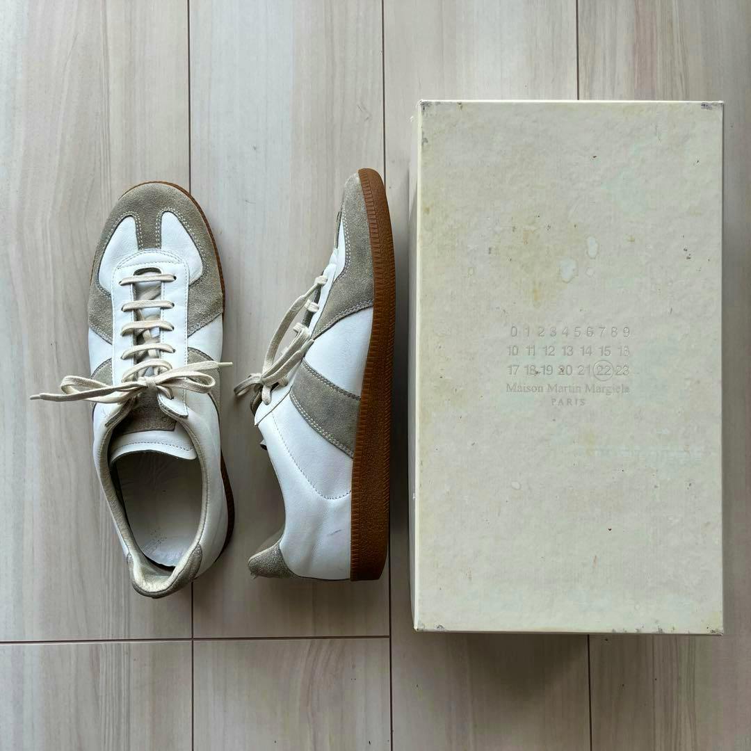 Top-down view of the Maison Margiela Replica German Trainer sneakers (size 42) shown next to their shoebox.