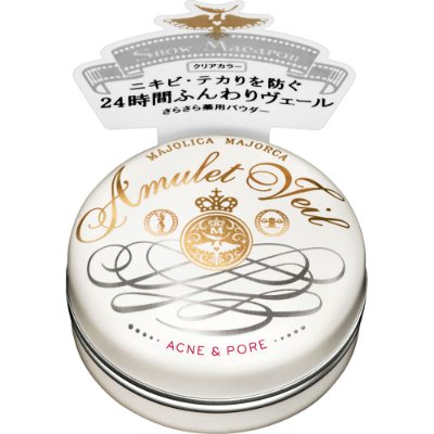 Round white tin of マジョリカ マジョルカ アミュレットヴェール face powder with gold decorative lettering and a small product tag in Japanese.