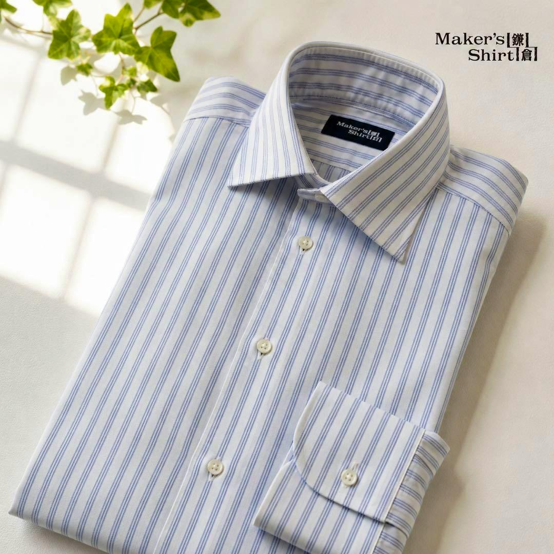 Folded men's striped cotton dress shirt in blue and white showing collar, buttons, and cuff.