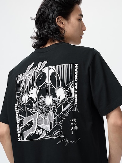 Back view of a black cotton T-shirt featuring a Kinnikuman manga-style graphic, worn by a model.