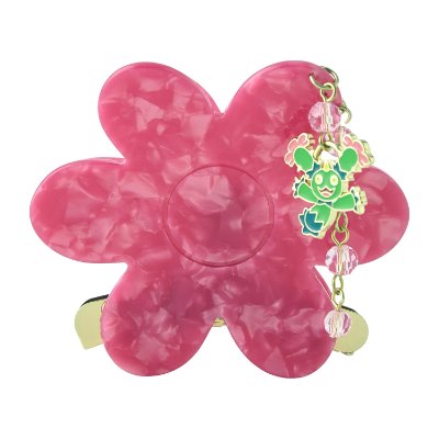 Pink flower-shaped hair clip with a small dangling green character charm.