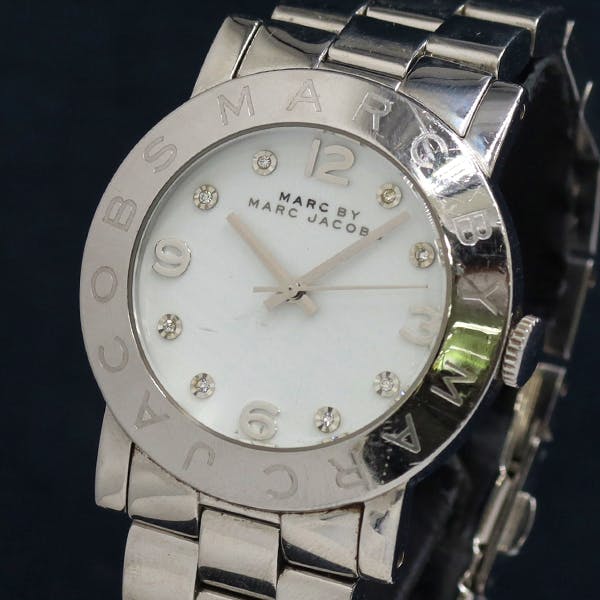 Front view of Marc by Marc Jacobs women's watch MBM3054 with a white dial, crystal hour markers, and a metal bracelet.