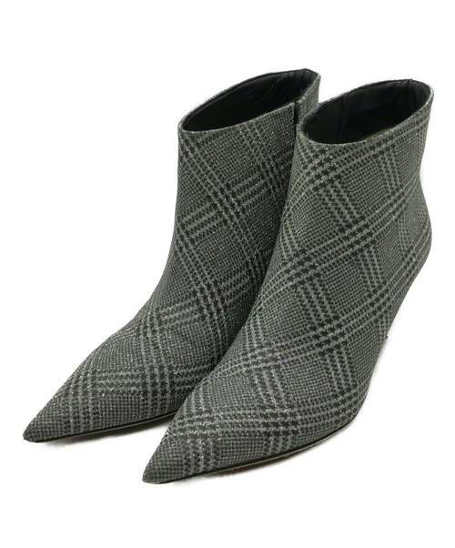 Pair of pointed-toe ankle pumps in gray plaid synthetic leather.