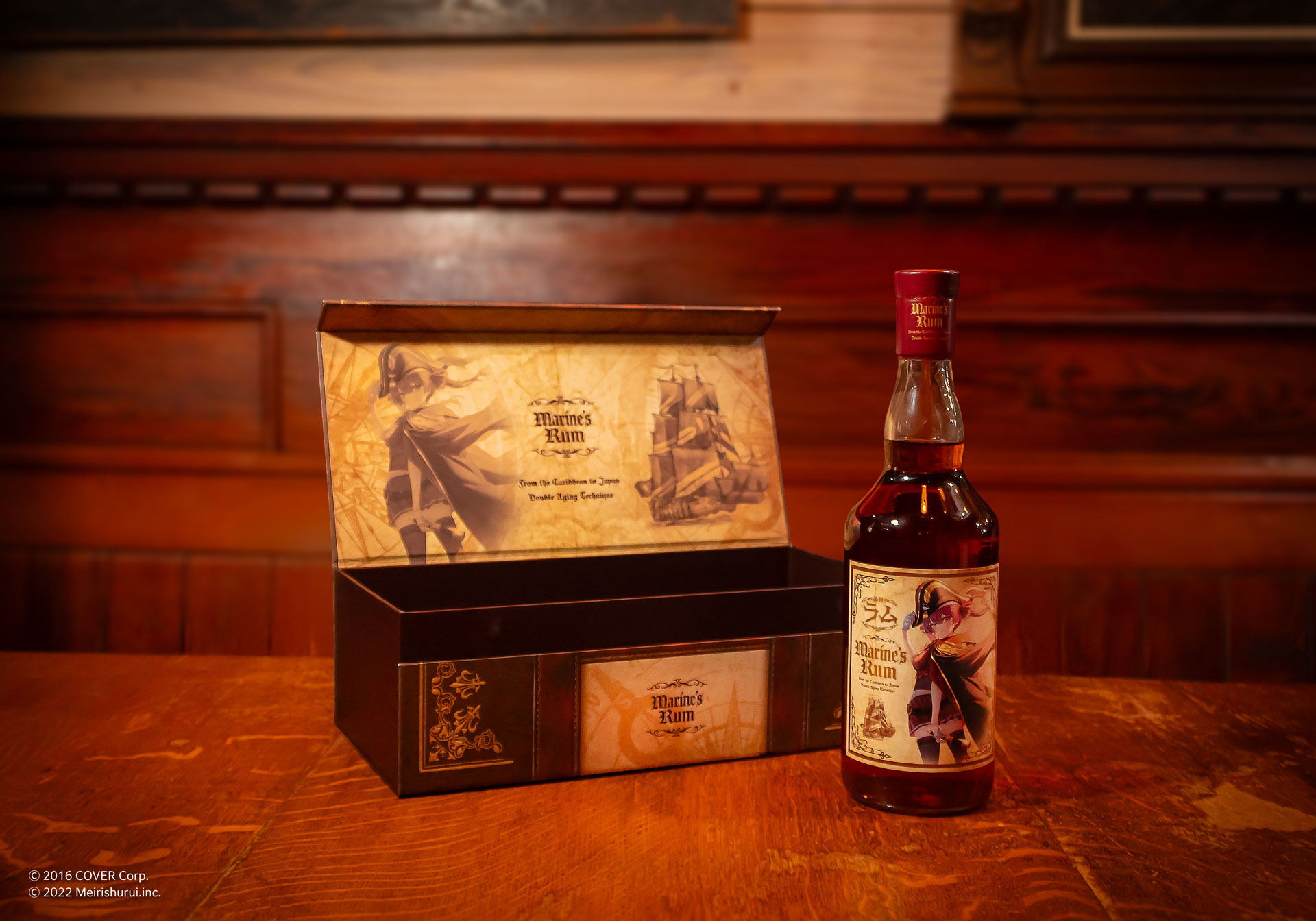 A bottle of ALC.35％ マリンズラム 700ml shown next to its open presentation box on a wooden table.