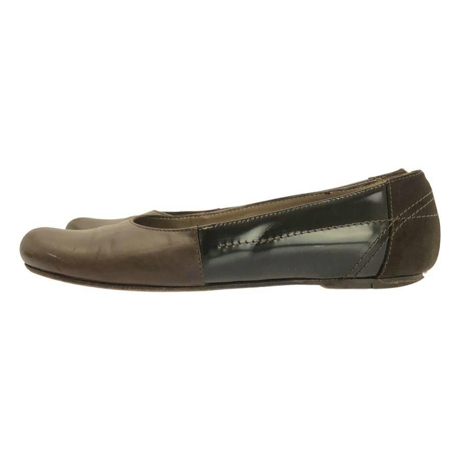 Side view of a MARNI leather and suede flat pump showing the mixed leather and suede panels.