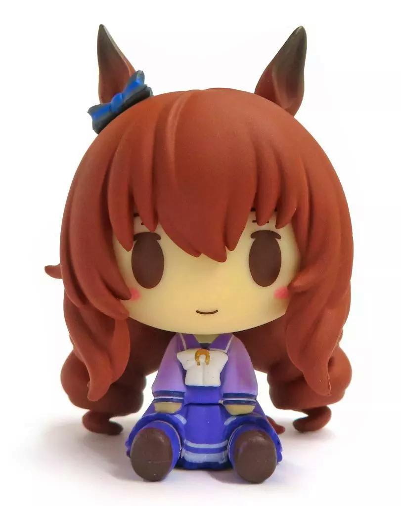 Front view of the trading figure Maruzensky from Uma Musume, a small seated chibi plastic figure with brown hair, horse ears, and a purple outfit.