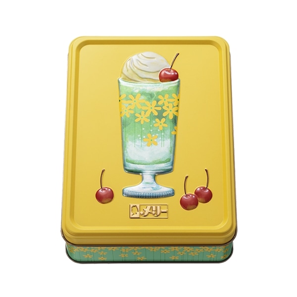 Yellow rectangular metal tin featuring an illustrated green soda float topped with whipped cream and cherries.
