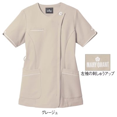 Front view of a beige women's short-sleeve, front-open stretch jacket with two front pockets, white trim, and an inset close-up of brand embroidery.