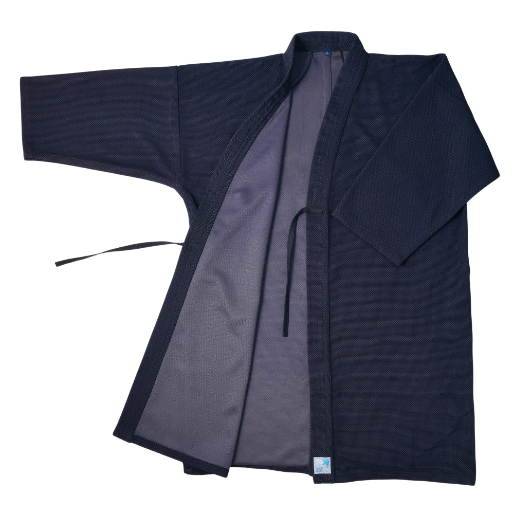 Women's polyester kendo jacket (kendogi) in navy laid flat and open to show the interior and tie cords.