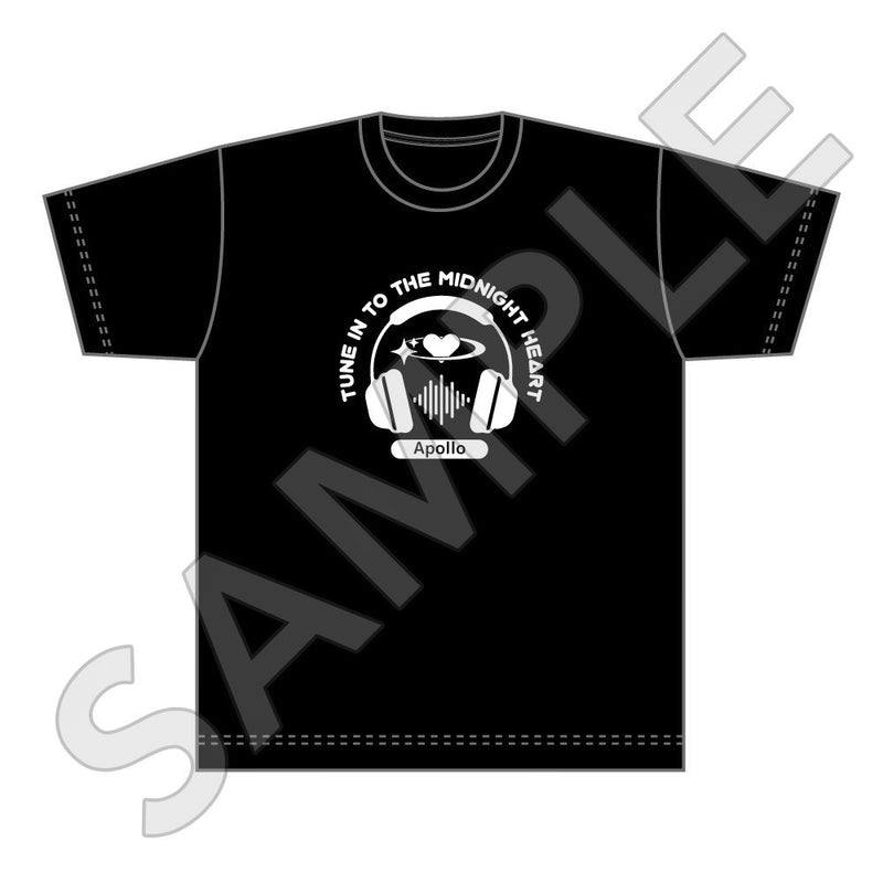 Front-view mockup of a black cotton T-shirt featuring a white headphones-and-heart graphic with the text "TUNE IN TO THE MIDNIGHT HEART".