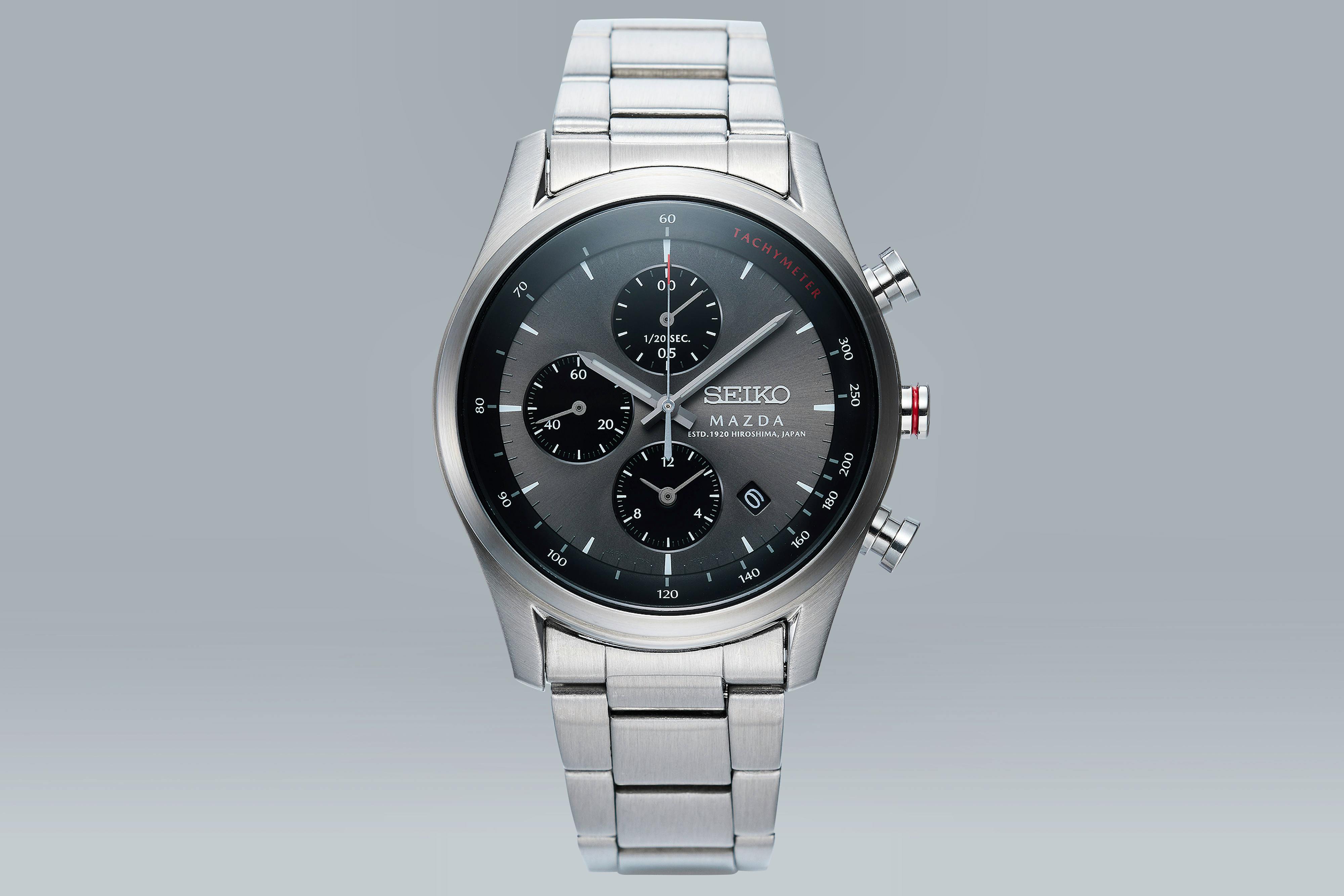 Front view of the MAZDA chronograph watch showing the round dial with three subdials and a metal bracelet.