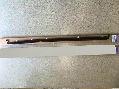 Outer door window weatherstrip for Mazda Roadster NA/NB laid on cardboard packaging, showing the black molding and clips.