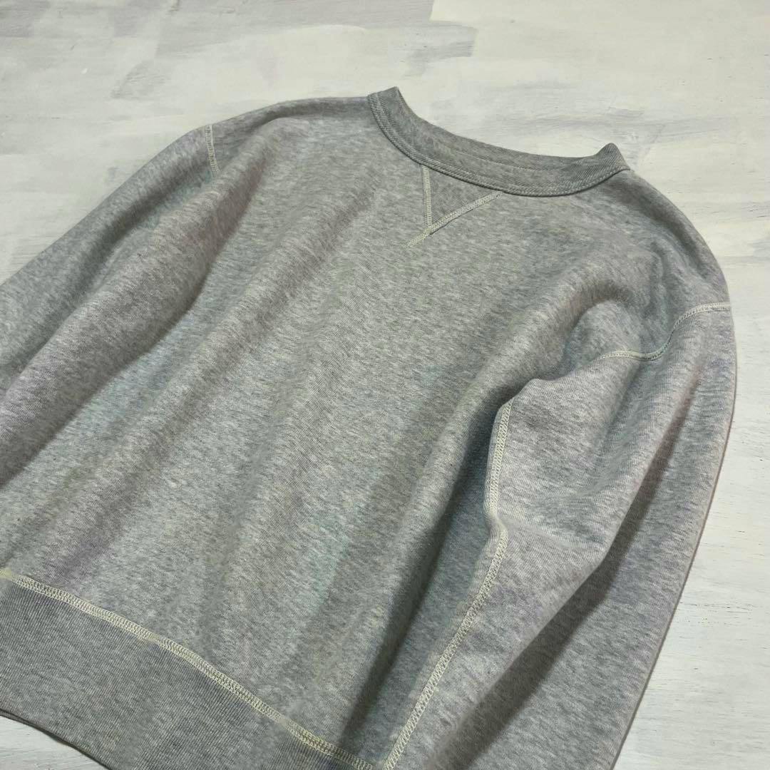Gray McCOY'S cotton sweatshirt laid flat showing the front, neckline and sleeve stitching.