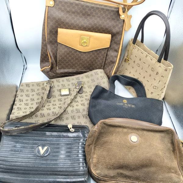 Group photo showing the MCM Visetos-pattern bags and other handbags arranged together on a surface.